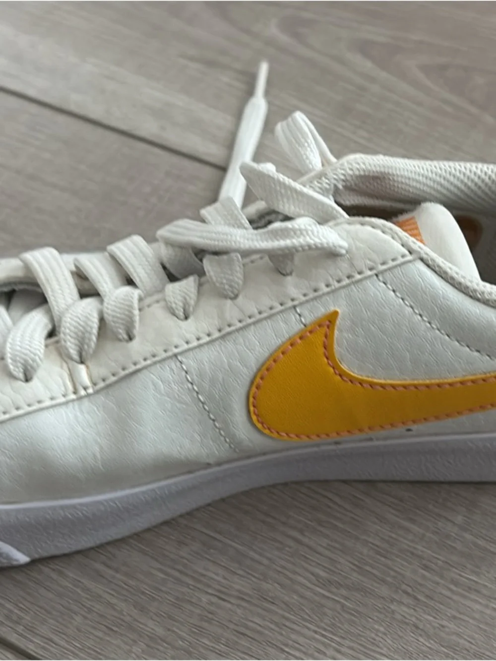 Nike White Sneakers with Yellow Swoosh